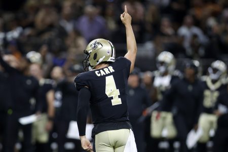 Derek Carr of the New Orleans Saints reacts after throwing a TD.