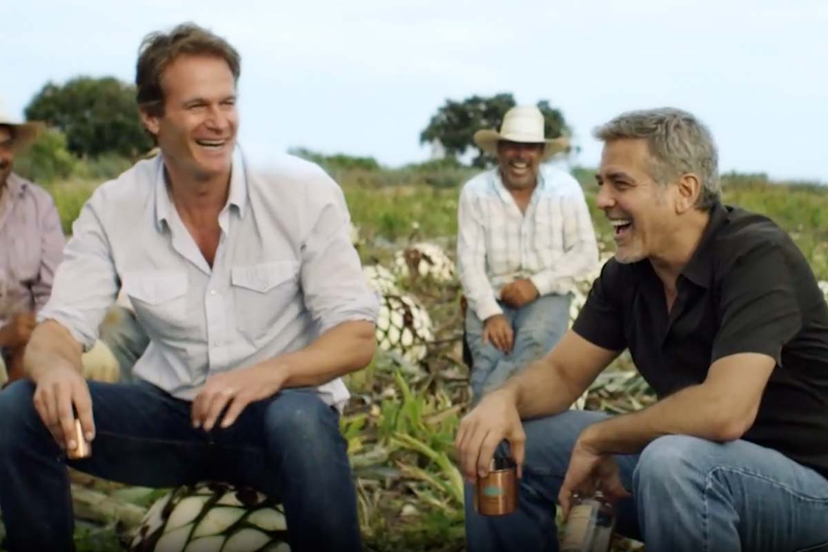 Rande Gerber and George Clooney of Casamigos in an agave field