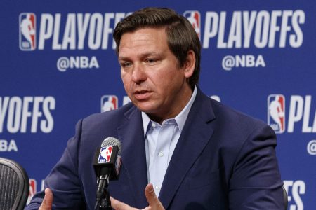 Ron DeSantis speaks to the media before a 2019 NBA playoff game.