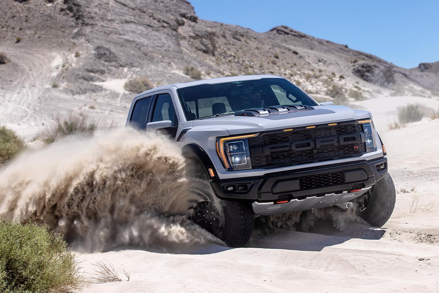 2023 Ford F-150 Raptor R spinning tired in the sand