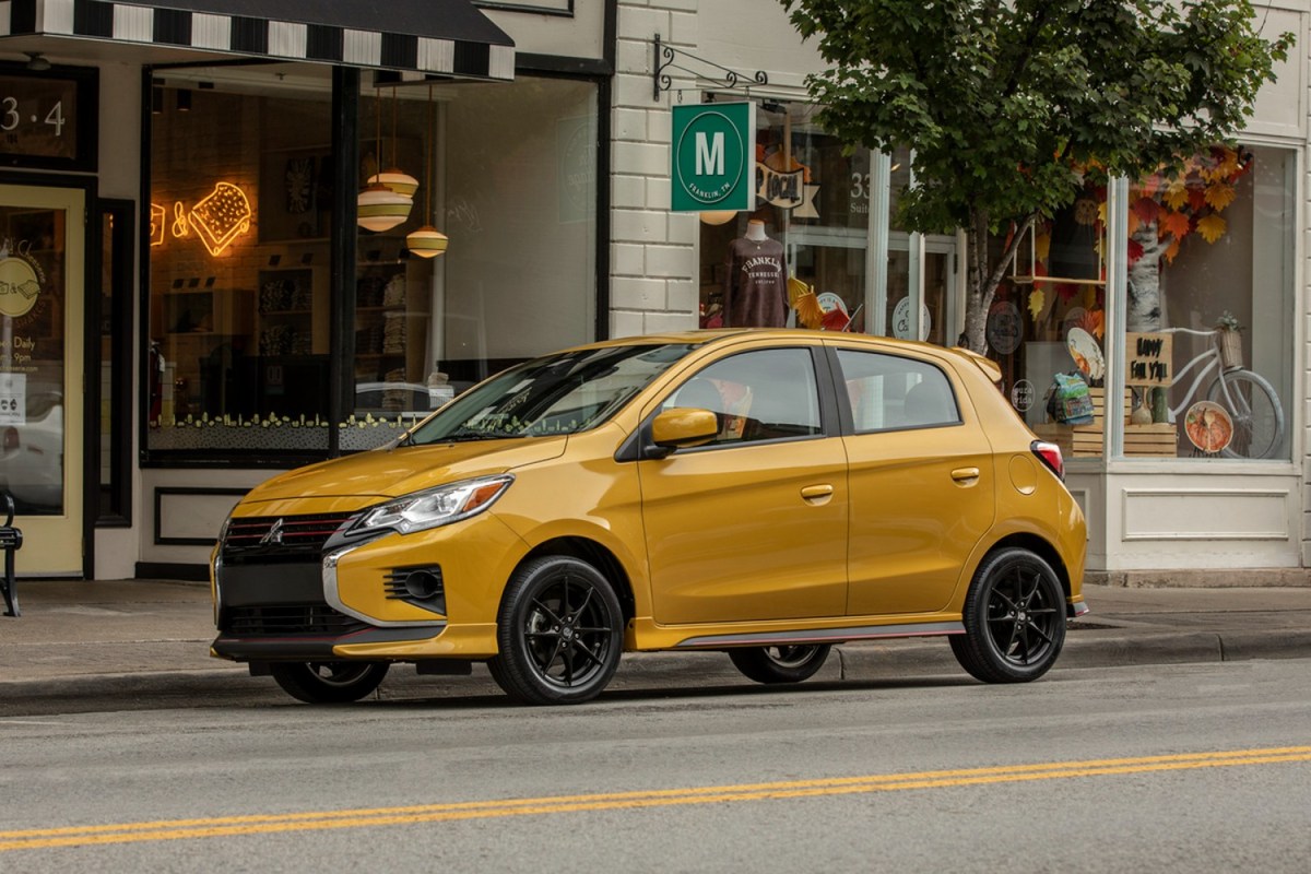 2023 Mitsubishi Mirage in gold sitting parked at a curb