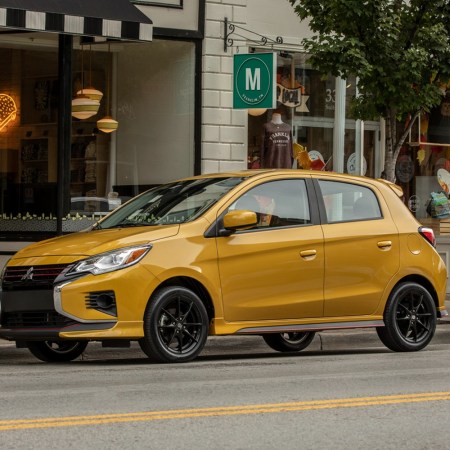 2023 Mitsubishi Mirage in gold sitting parked at a curb