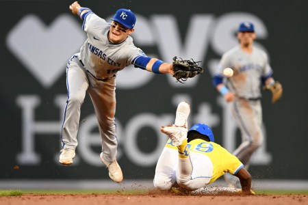 Red Sox Pablo Reyes slides into second base after a throwing error.