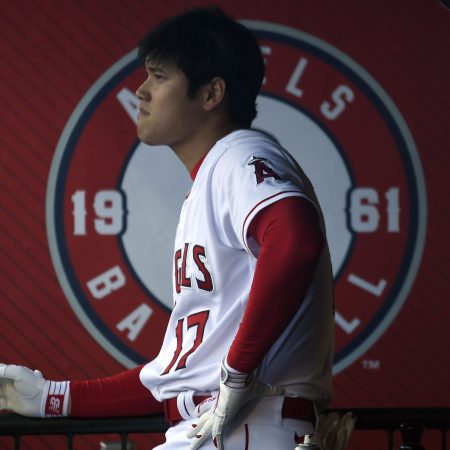 Shohei Ohtani looks on from the dugout.