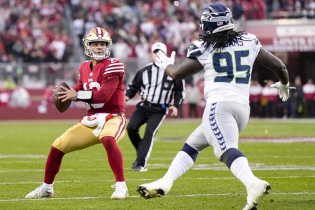 Brock Purdy of the San Francisco 49ers looks to pass against the Seattle Seahawks. Today we look at how to bet the NFC West before the NFL regular season starts.
