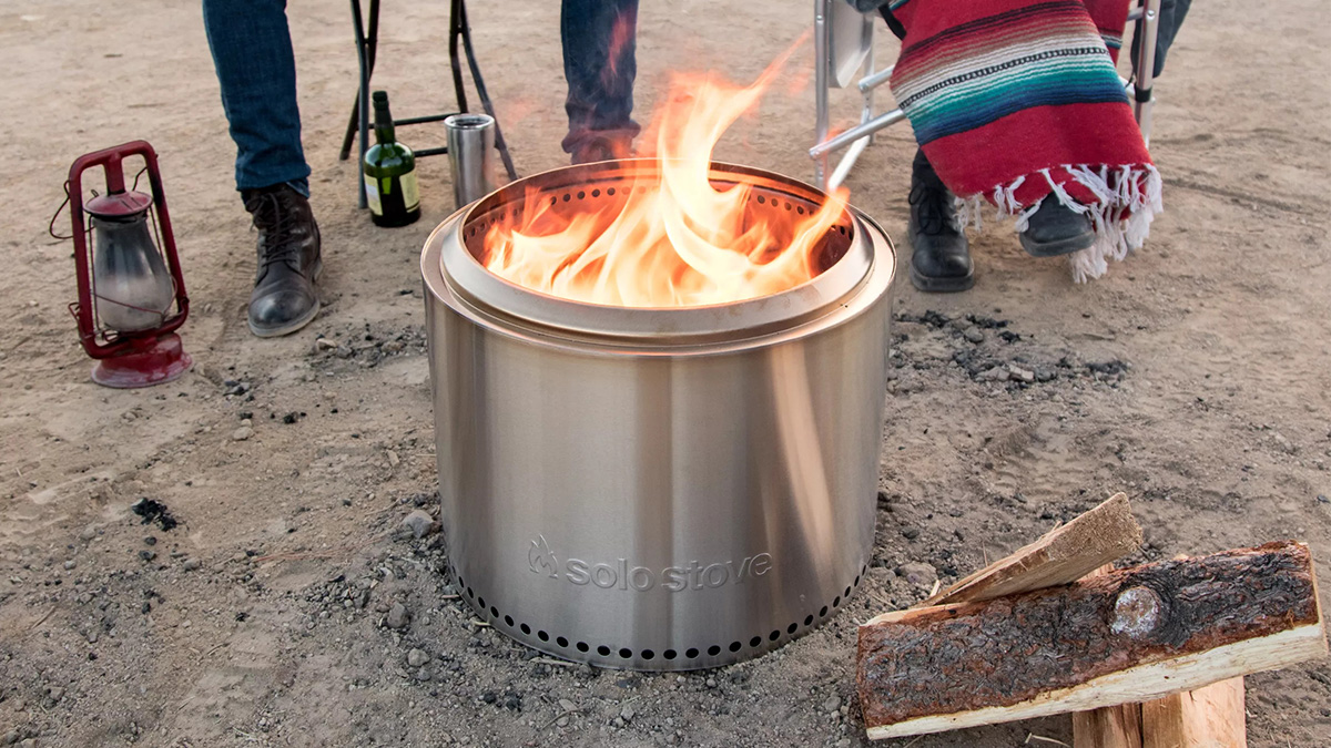 A bonfire pit from Solo Stove, on sale for Labor Day 2023, sitting on the beach