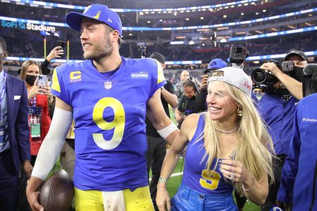 Matthew Stafford and his wife Kelly react after a win in the playoffs.