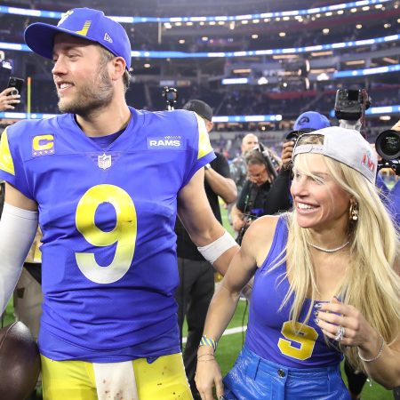 Matthew Stafford and his wife Kelly react after a win in the playoffs.