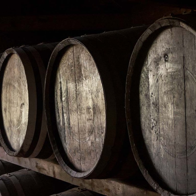 Wooden barrels in a warehouse of a whiskey distillery in Hokkaido, Japan. Barrels of whisky are being used as collateral for loans in Japan.