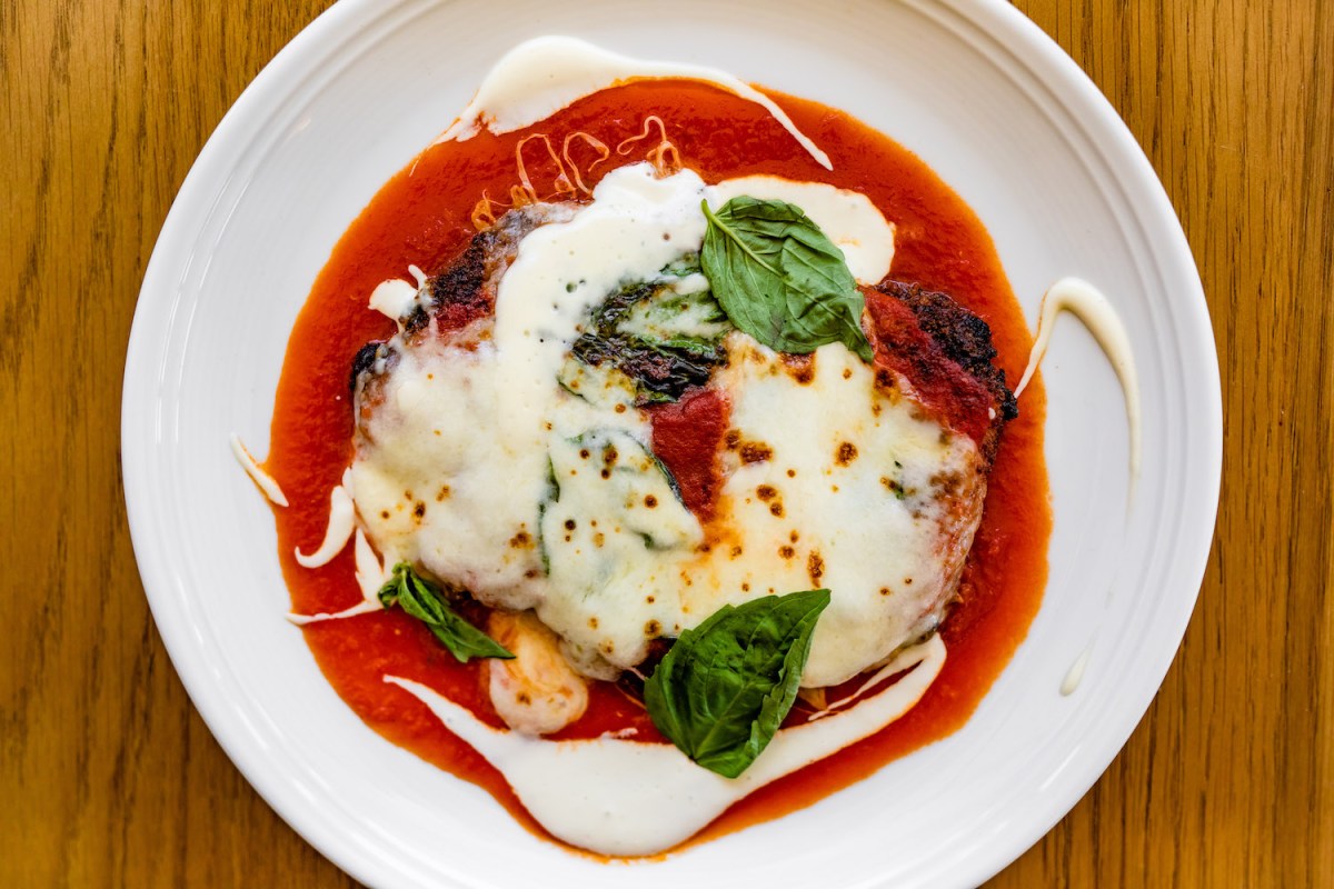 Plated chicken parm dish