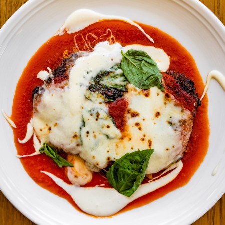 Plated chicken parm dish