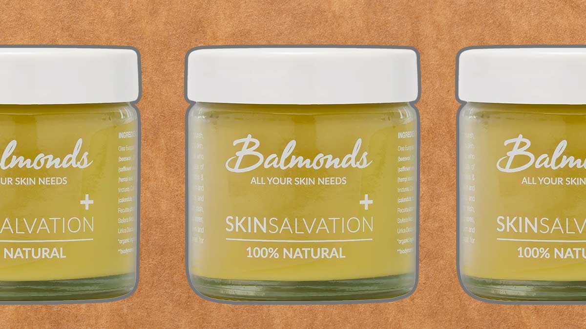 Balmonds Skin Salvation 100% natural moisturizing balm on a green background