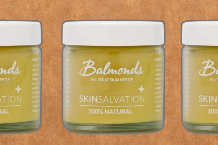 Balmonds Skin Salvation 100% natural moisturizing balm on a green background
