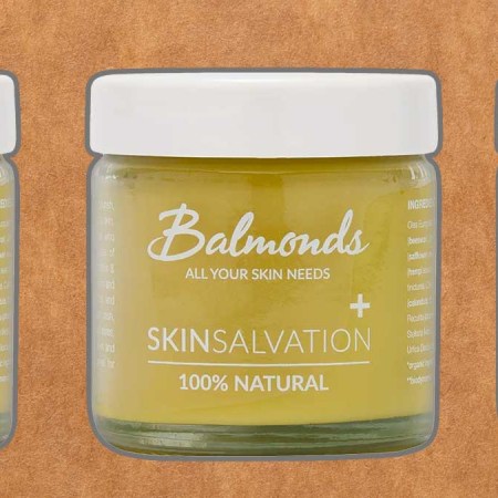 Balmonds Skin Salvation 100% natural moisturizing balm on a green background