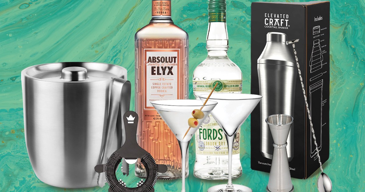 Various bar tools and booze bottles, ideal for a bar cart