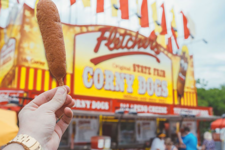 Corn dog being held outside of Fletcher's