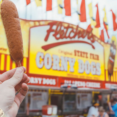 Corn dog being held outside of Fletcher's