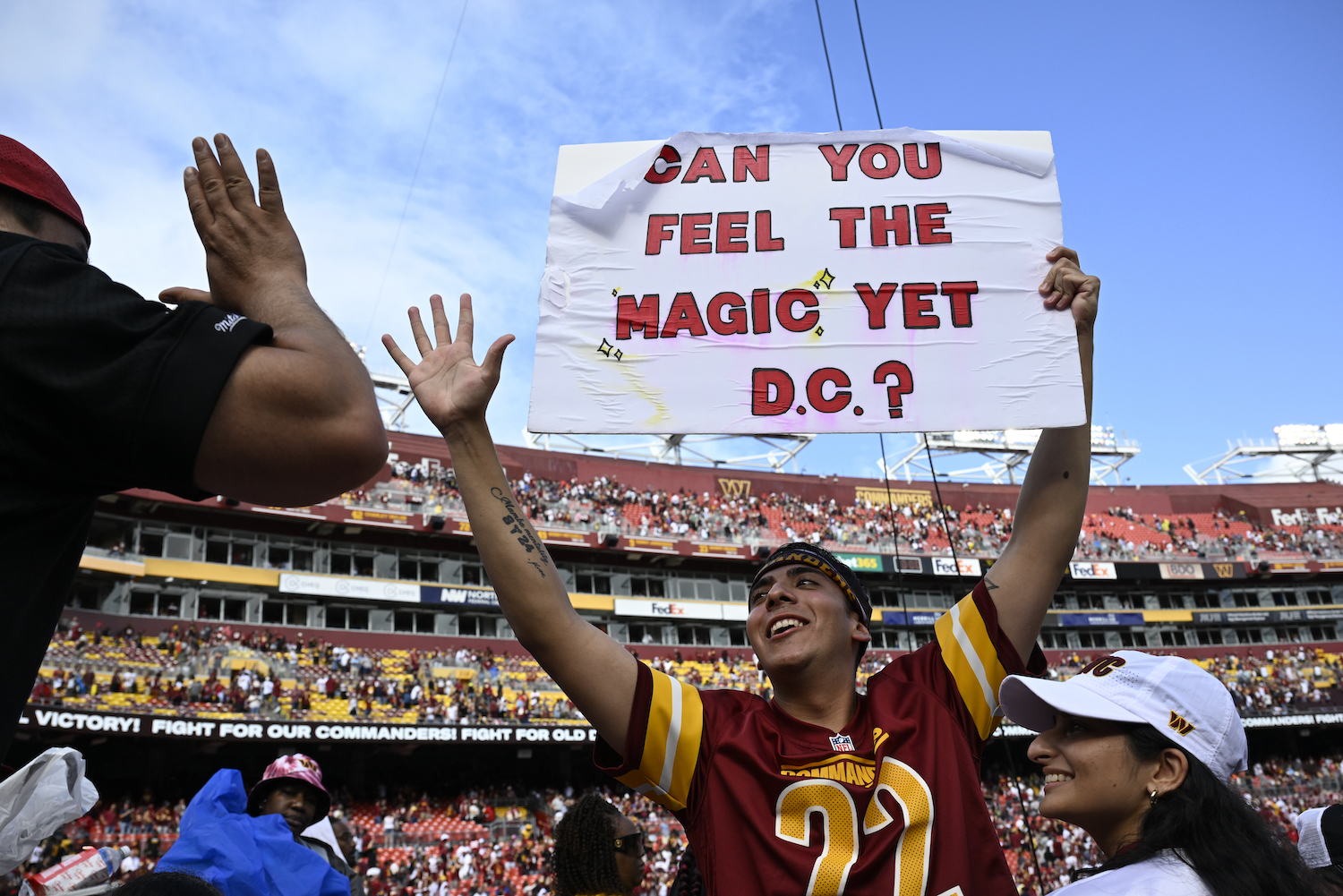Commanders fan Logan Edwards celebrates after the game against the Arizona Cardinals at FedEx Field on September 10, 2023.