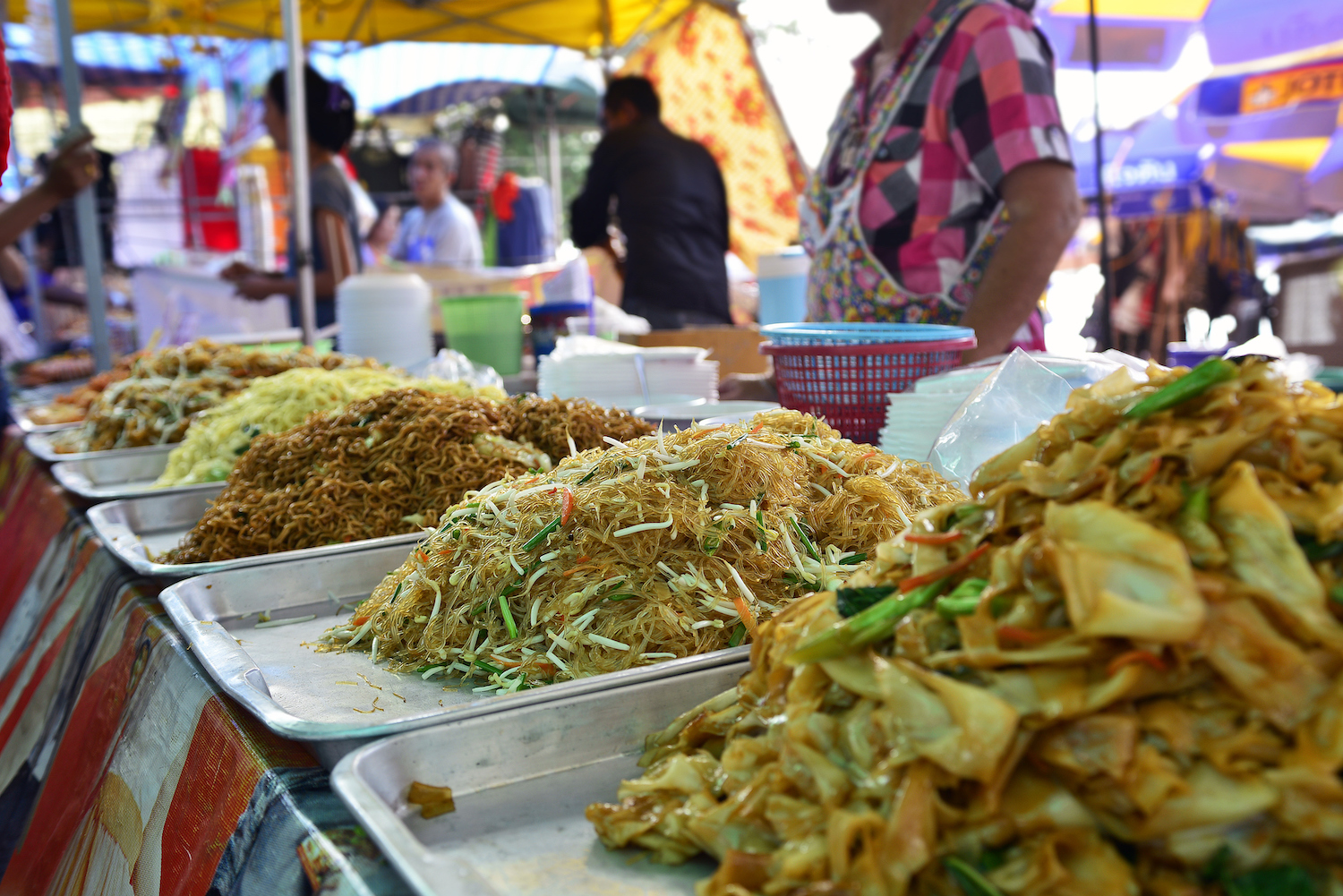 Piles of noodles at a street market in Thailand