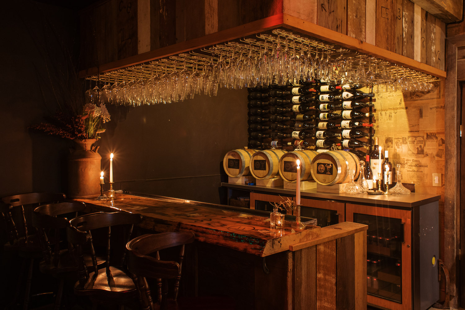 Dim bar area with glasses and bottles