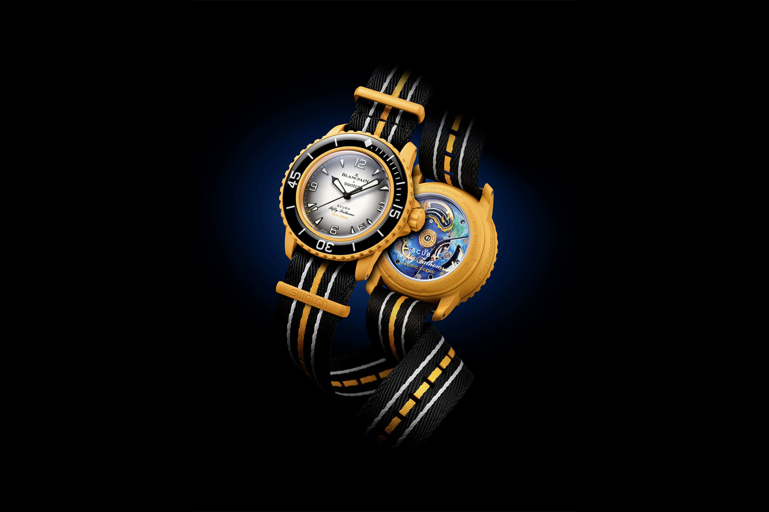 Gold and Black watch with a white face and an ocean design inside