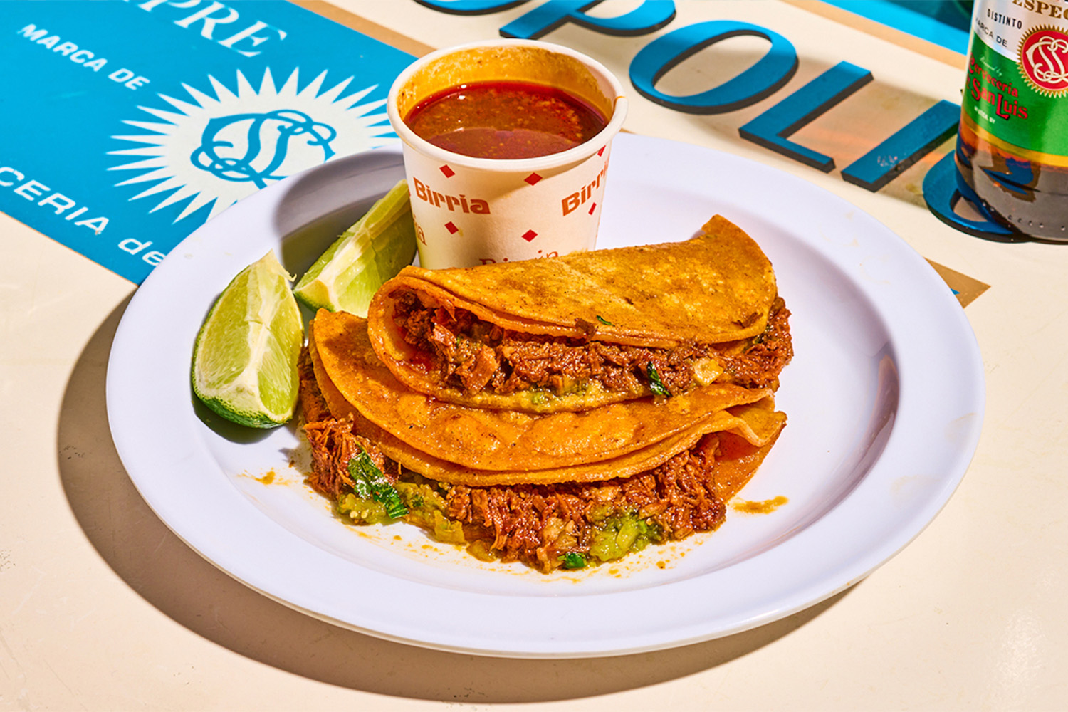 Birria tacos on a plate with a lime slice miami's best new restaurants