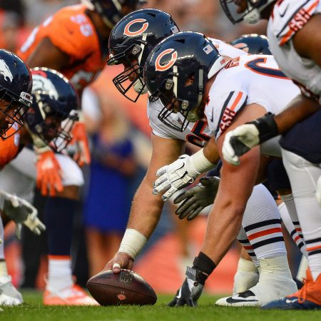 The Chicago Bears and Denver Broncos line up during a preseason game.