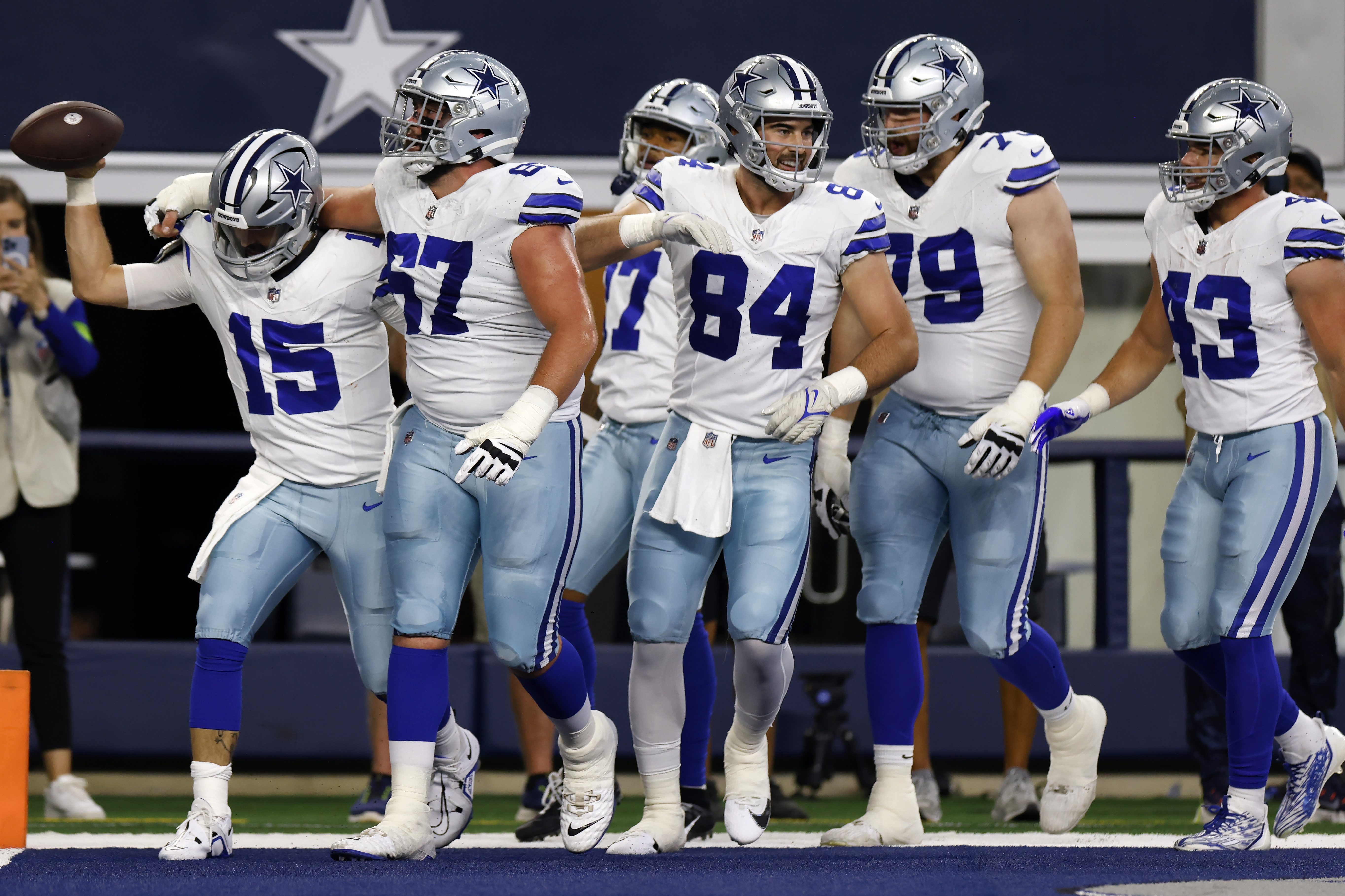 The Cowboys celebrate running a touchdown against the Raiders.
