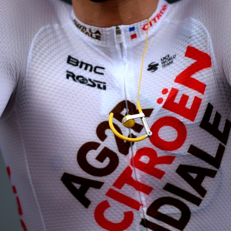A close-up of a cyclist's chest with headphones dangling.
