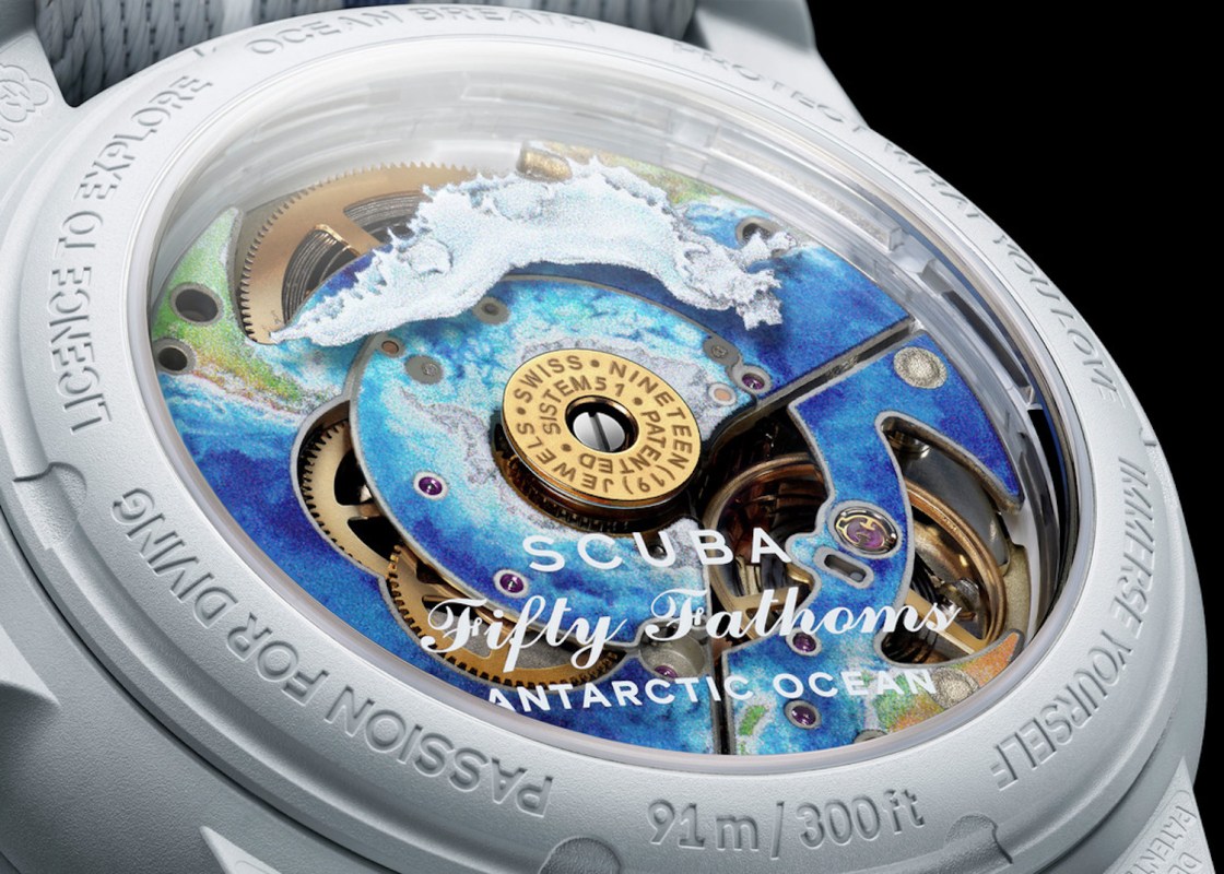 Silver watch with ocean design on the inside