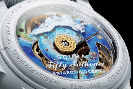 Silver watch with ocean design on the inside