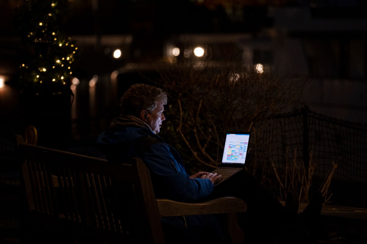 A man staring at a computer screen in the dark. We discuss the phenomenon of screen apnea.