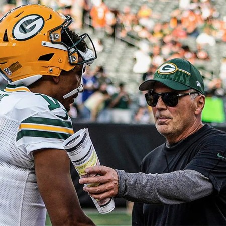 Quarterback coach Tom Clements talks to Jordan Love before the Packers play the Bengals.