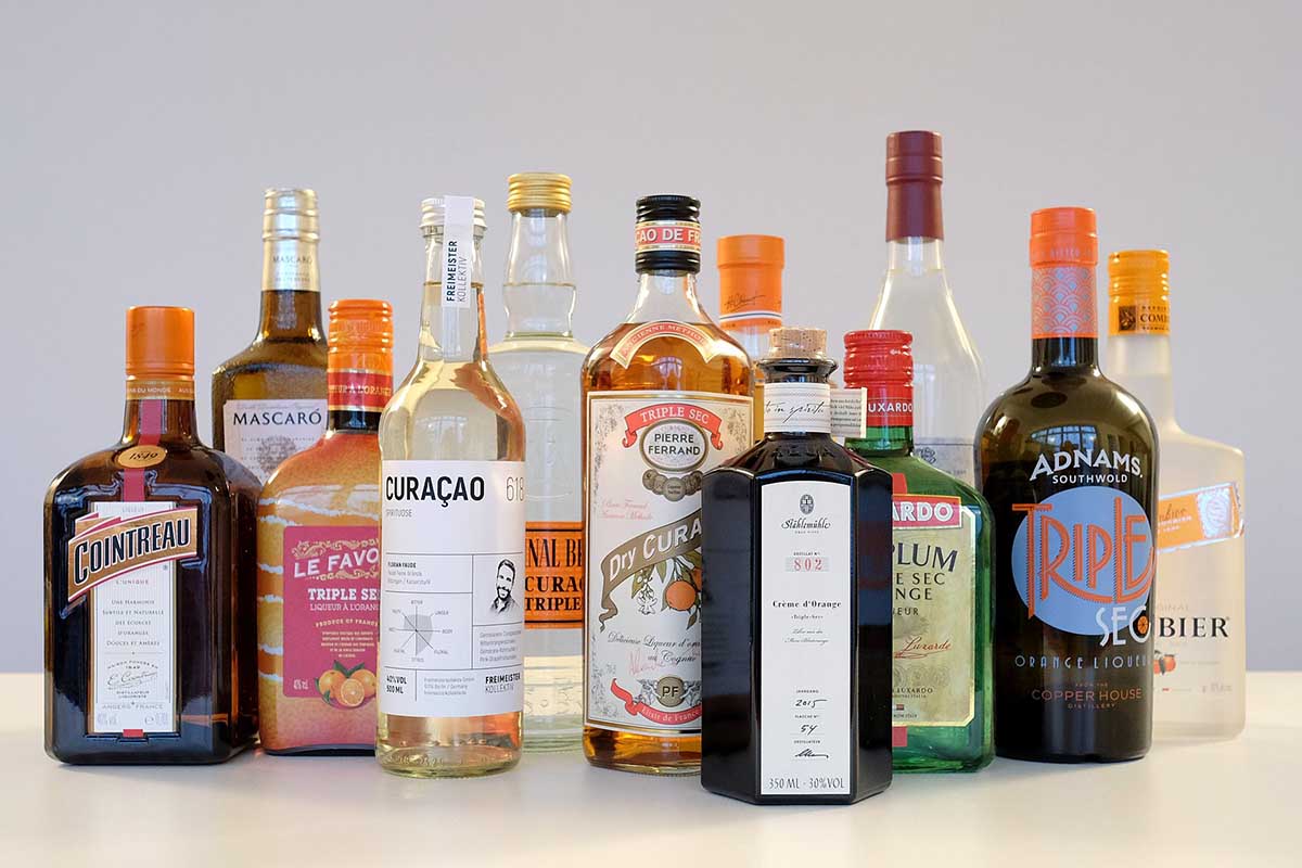 Several bottles of triple sec, including Cointreau