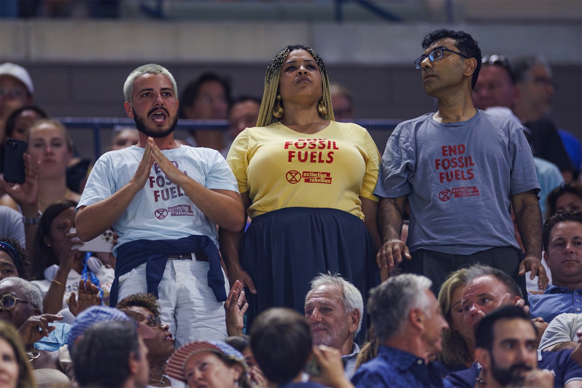 Three Extinction Rebellion protesters disrupt play at the U.S. Open.