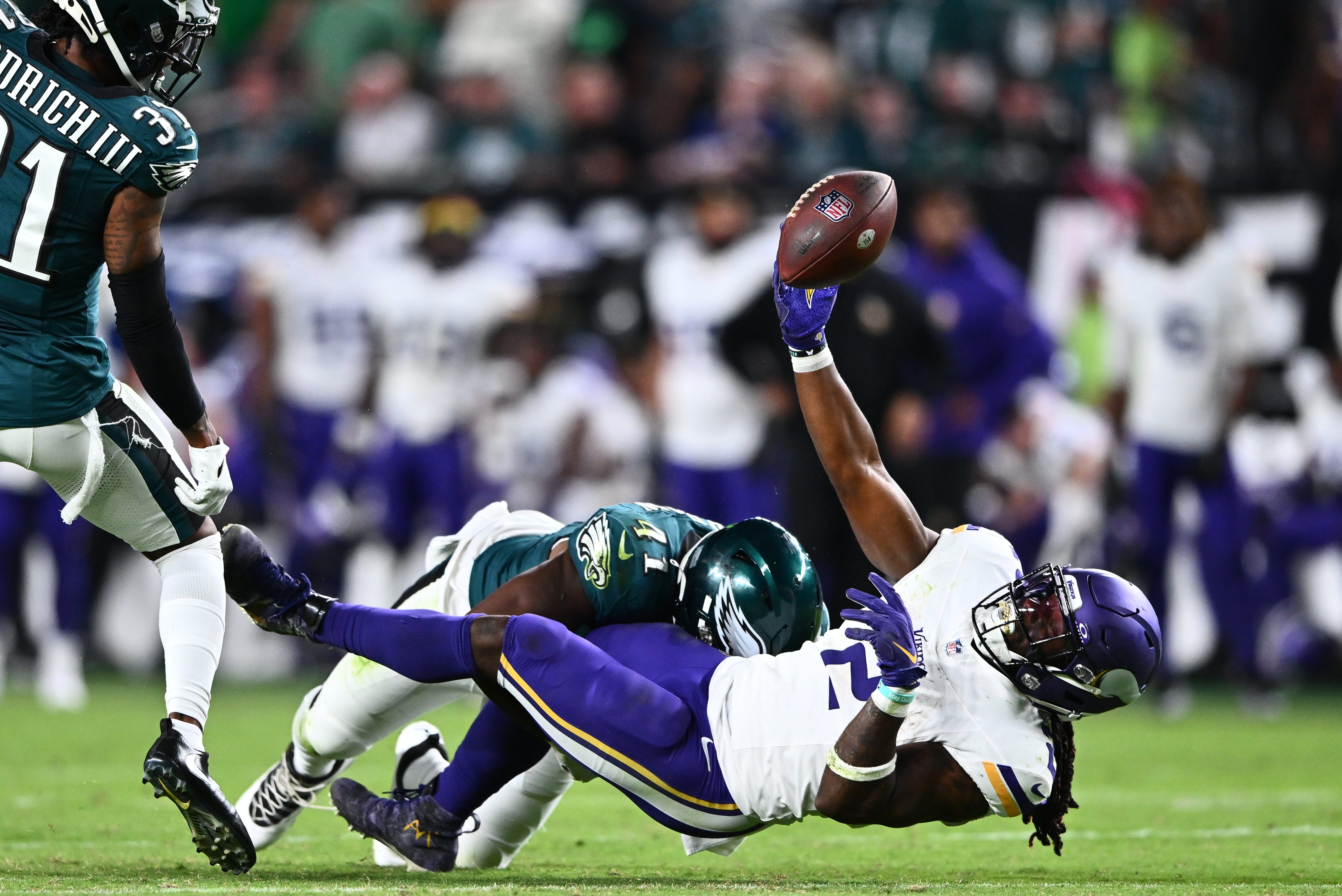 Minnesota running back Alexander Mattison fumbles the ball.