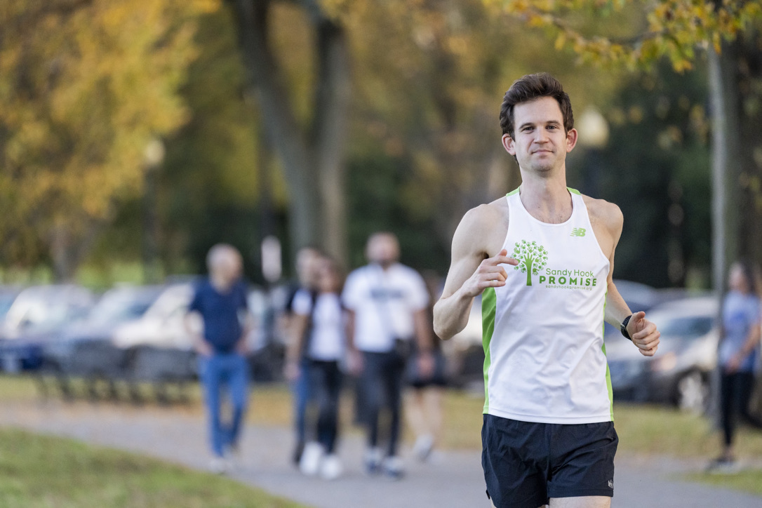 A man wearing a singlet that says Sandy Hook Promise, training for the marathon.