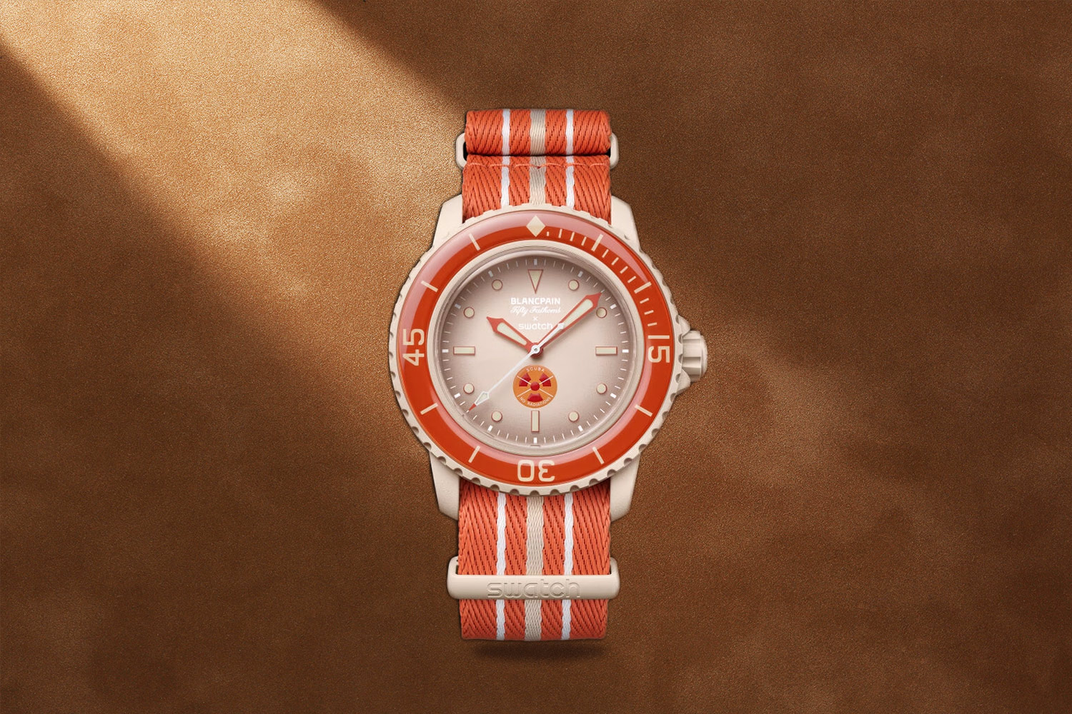 Red- and cream-colored watch