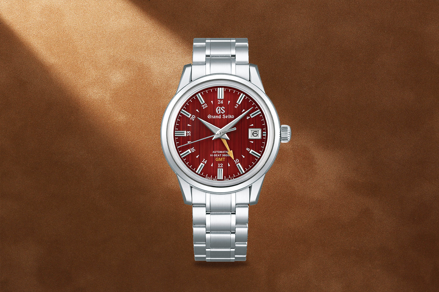 Silver watch with a red face