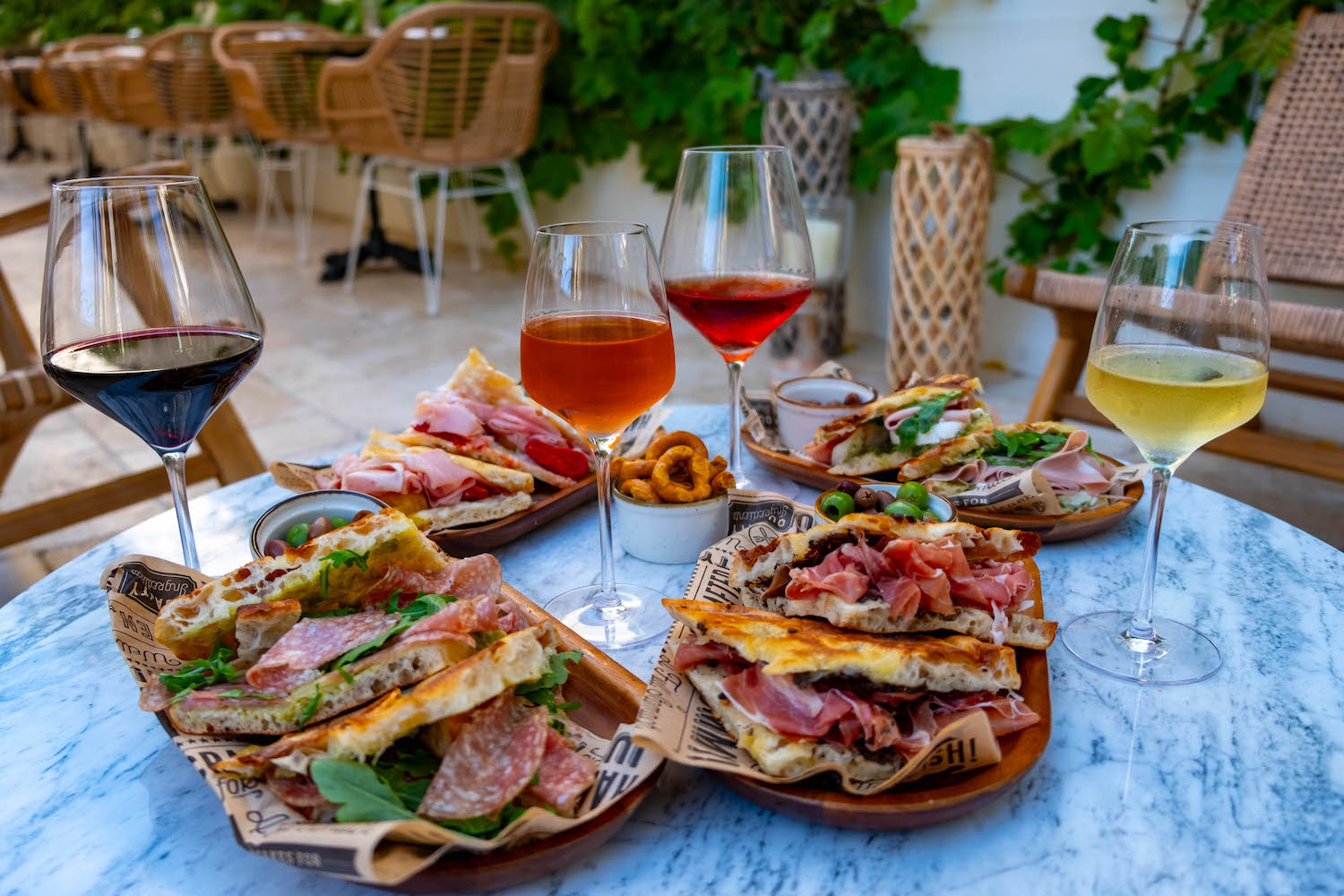 Spread of wine and sandwiches on a table