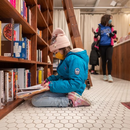 Neviana Racheva, 8, reads a book at Bold Fork Books in Washington, DC
