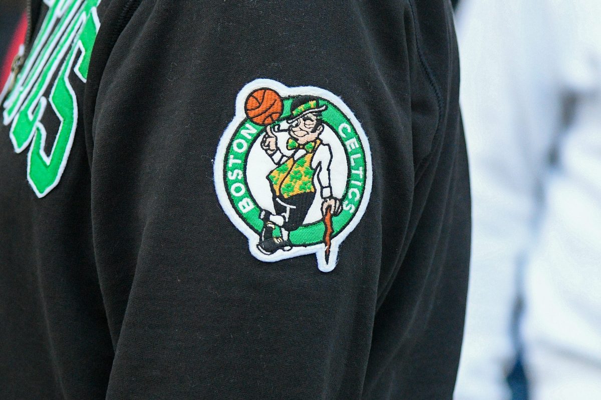 The Celtics logo on a fan's sweatshirt.