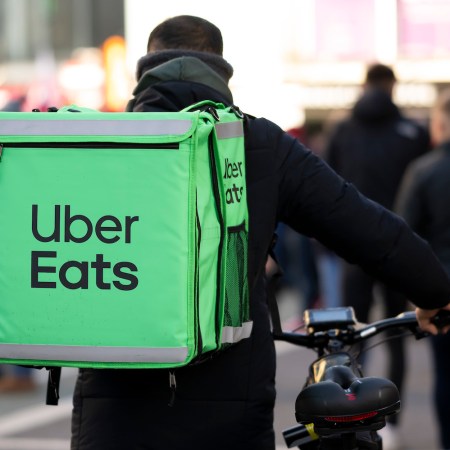 An Uber eats worker on a bicycle November 19, 2022 in Cardiff, Wales