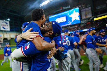 Jose Leclerc and Adolis Garcia of the Texas Rangers celebrate on field after defeating the Houston Astros in Game 7 of the ALCS at Minute Maid Park on Monday, October 23, 2023 in Houston, Texas. The Texas Rangers won 11-4.