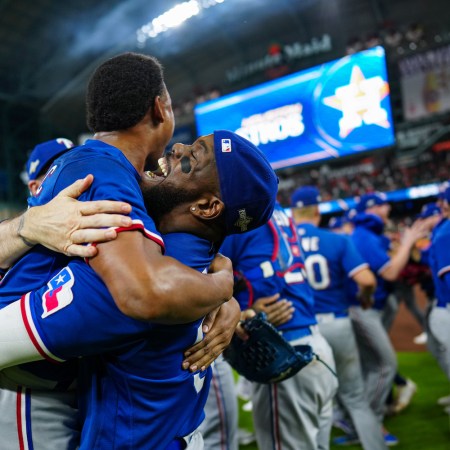 Jose Leclerc and Adolis Garcia of the Texas Rangers celebrate on field after defeating the Houston Astros in Game 7 of the ALCS at Minute Maid Park on Monday, October 23, 2023 in Houston, Texas. The Texas Rangers won 11-4.