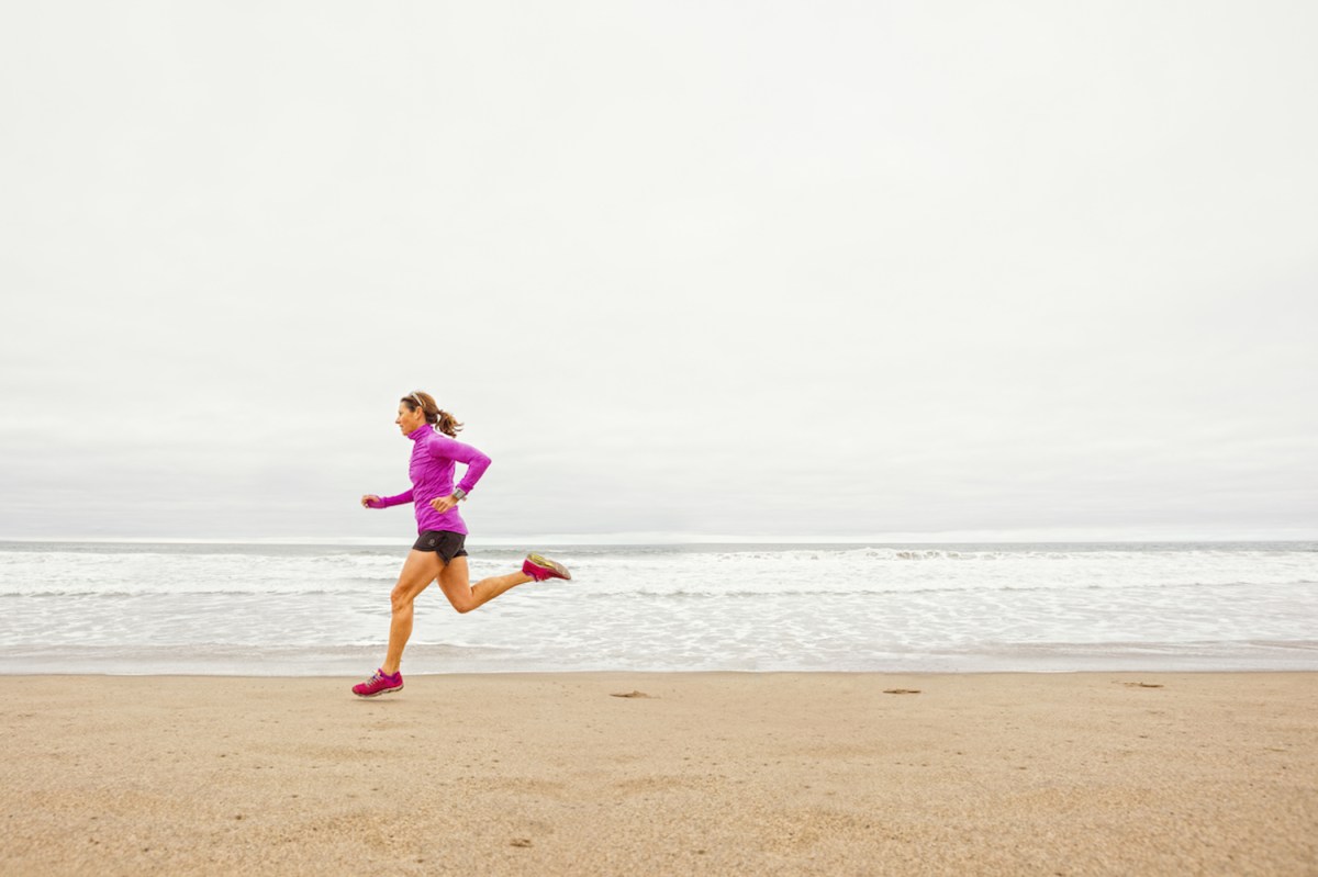 Woman out for a training run on the beach in Santa Monica, CA