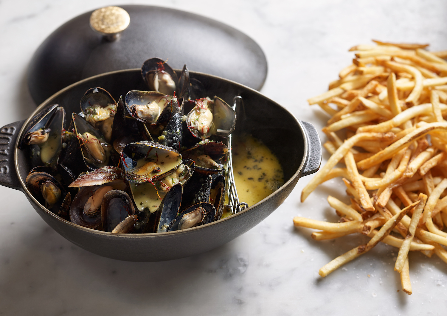 Moules au Safran | Maine bouchot mussels steamed with white wine, Dijon mustard & saffron, served with French fries
