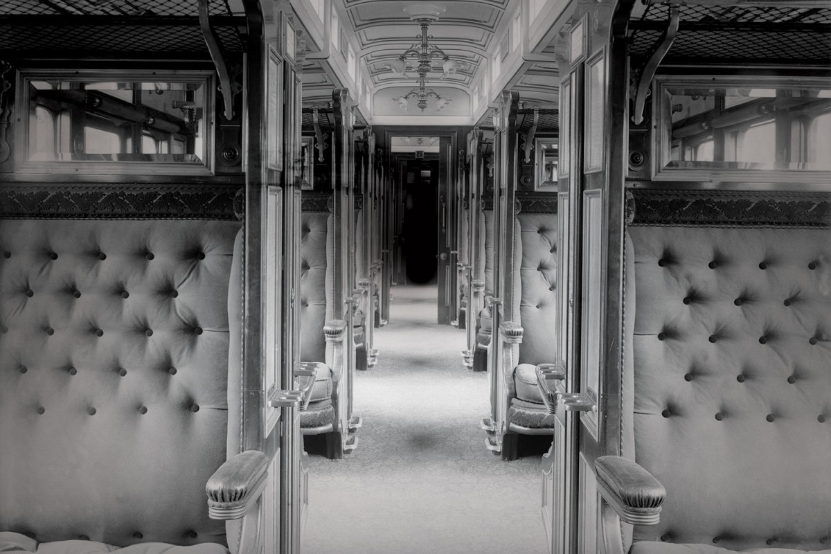 A train car in black and white. Ever wanted to live out "Murder on the Orient Express" in real life? These murder mystery trains offer you the chance.