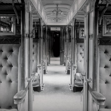 A train car in black and white. Ever wanted to live out "Murder on the Orient Express" in real life? These murder mystery trains offer you the chance.