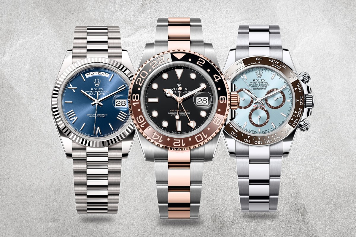 Three silver watches with blue and pink accents